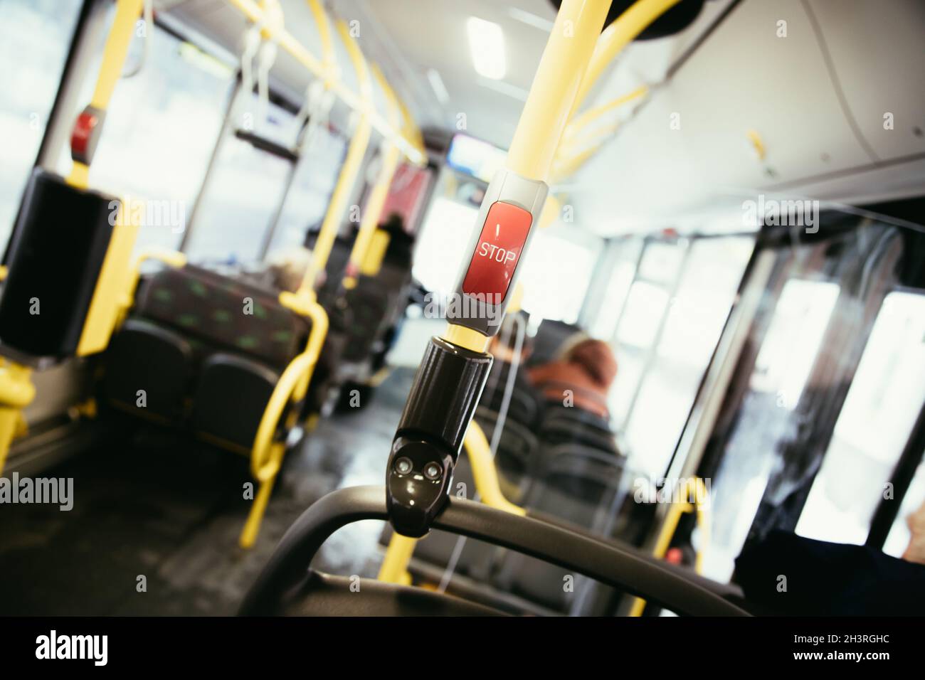 Red stop button in a bus, commuting, public transport Stock Photo