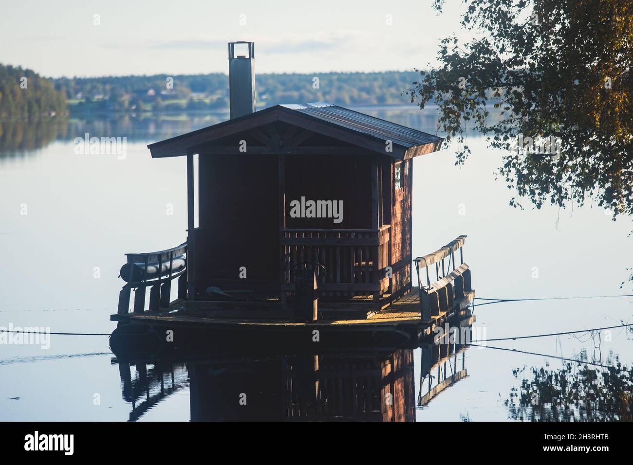 Finnish wooden floating sauna boat on the river in Lapland, Finland