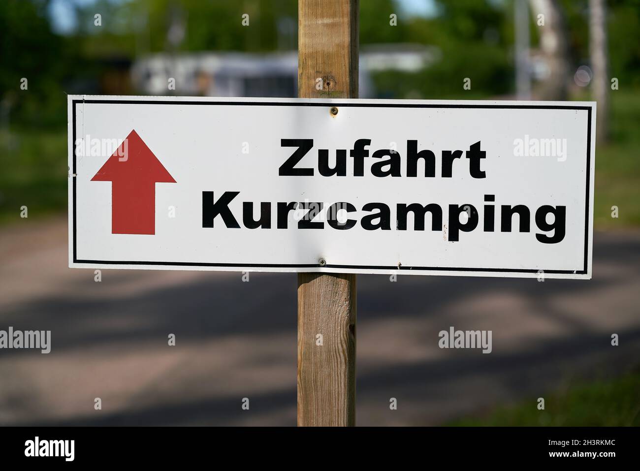 Signpost on a campsite in Germany with the inscription Access short camping (Zufahrt Kurzcamping) Stock Photo
