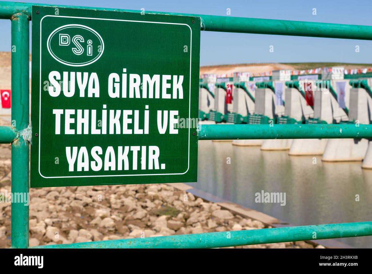General Directorate Of State Hydraulic Works (DSI) Afrin Stream Regulator. It is dangerous and forbidden to enter the water warning. Stock Photo
