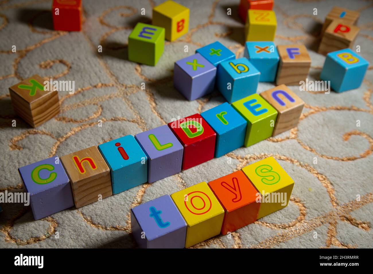 Children and toys written with colorful wooden game cubes. Children toys. Stock Photo