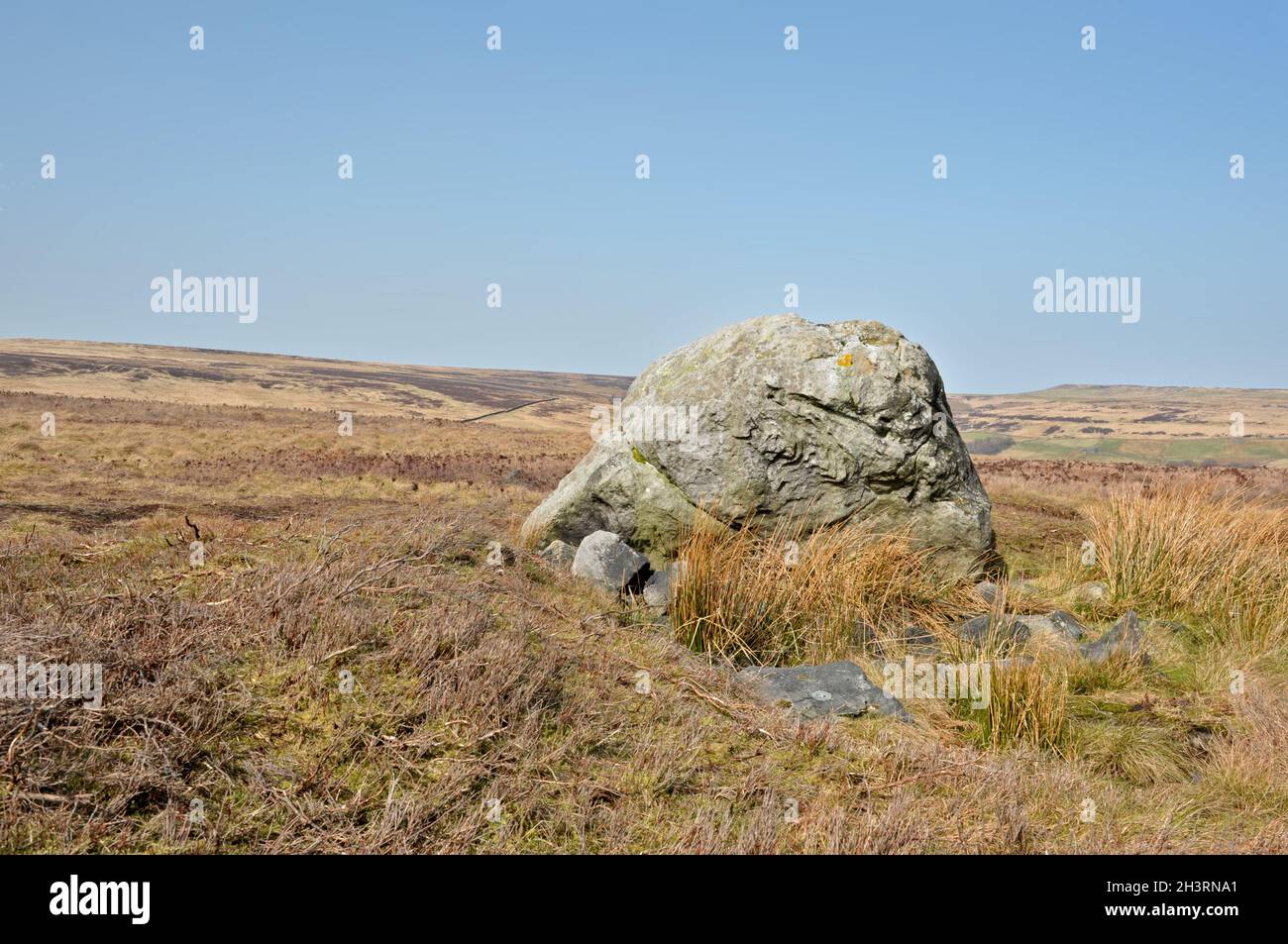 Pennine landscape with large old boulder or standing stone on midgley moor in west yorkshire Stock Photo