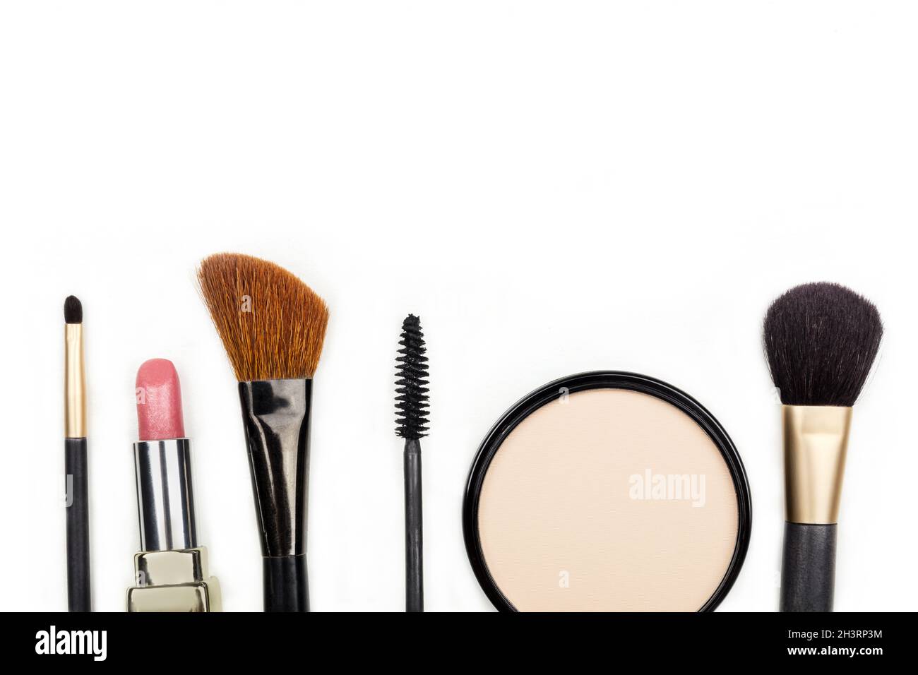 Makeup accessories, shot from above, with copy space on white Stock