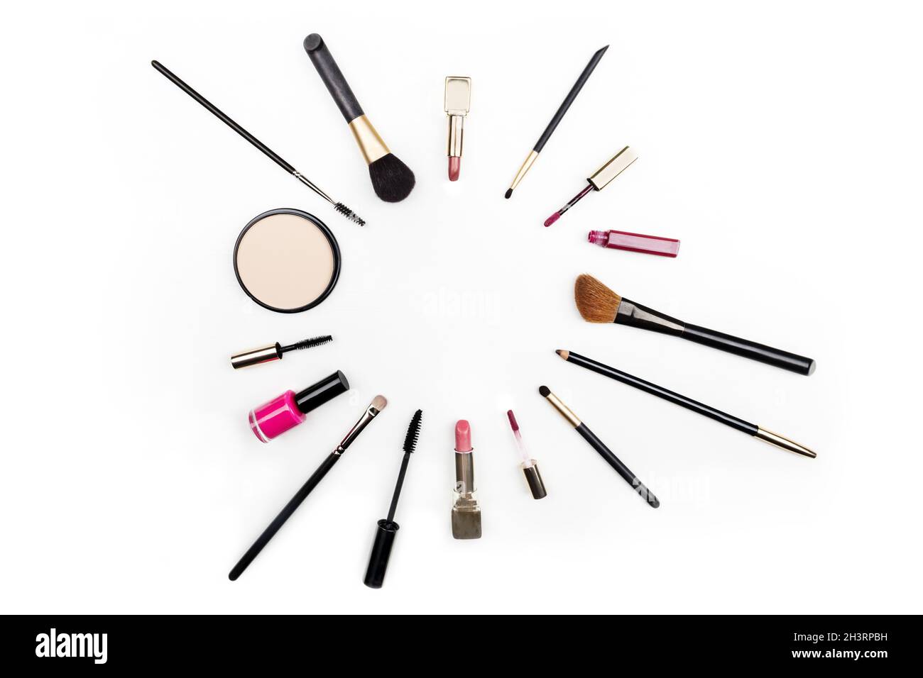 Makeup accessories forming frame with copy space on white Stock Photo