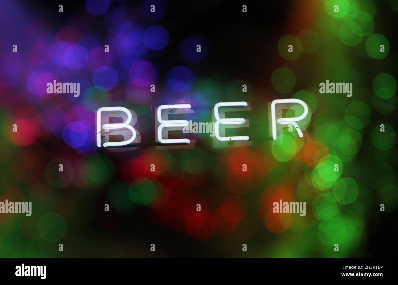 Neon Sign Neon Beer Sign With Colorful Bokeh Stock Photo