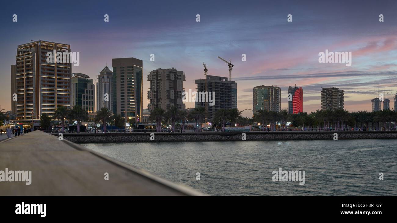 Lusail marina in Lusail city , Qatar at sunset with Yachts and boats  and Lusail skyline in background Stock Photo