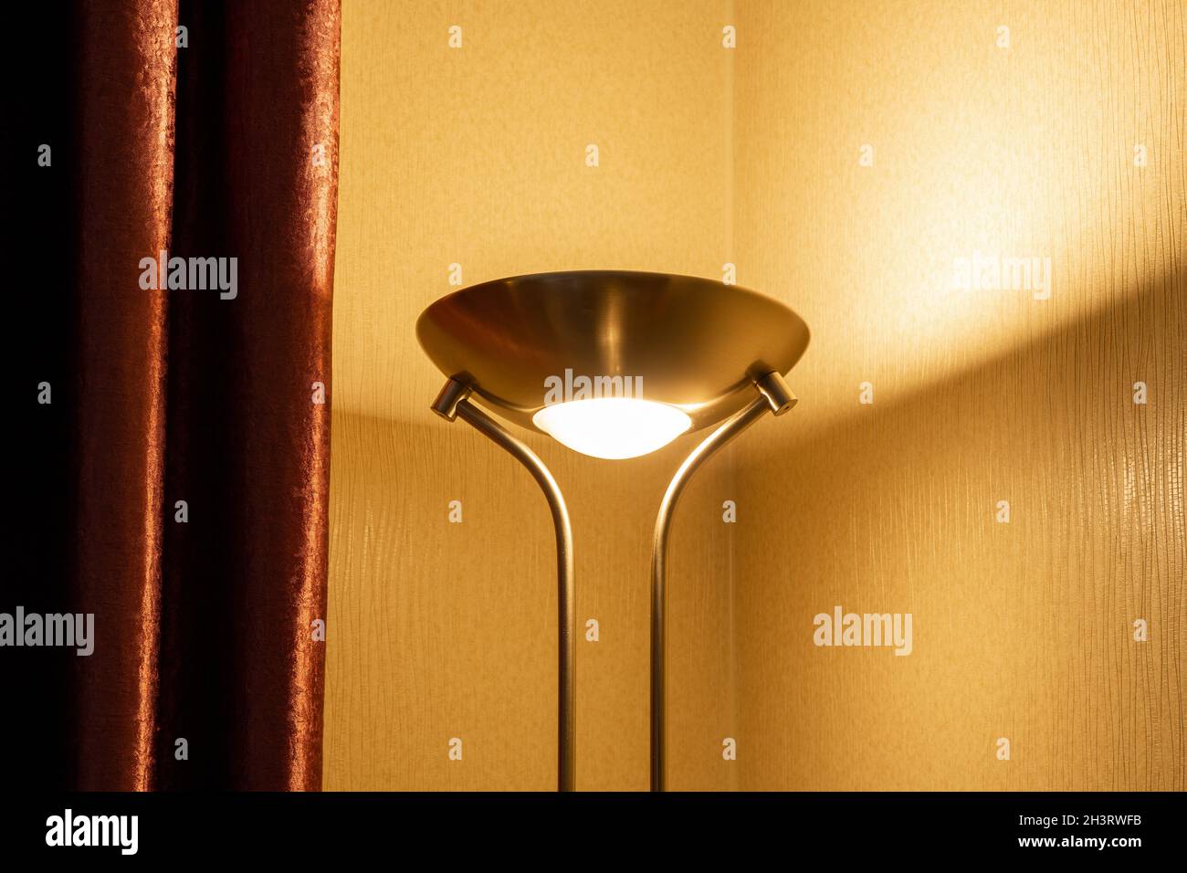 Modern style shiny metal floor lamp. Stock Photo