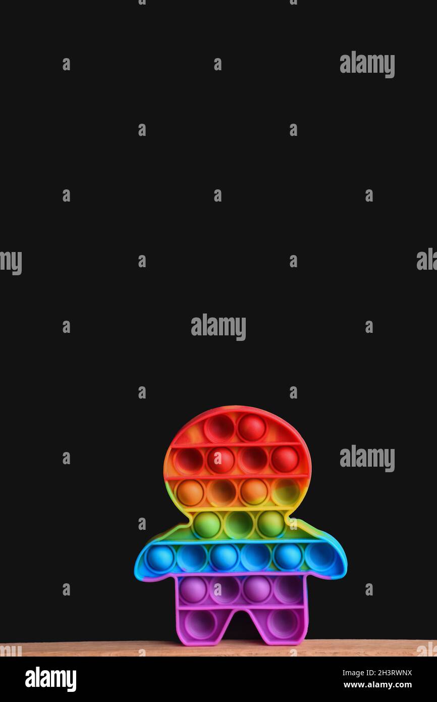 Rainbow toy pop it on a black background. mock up Stock Photo