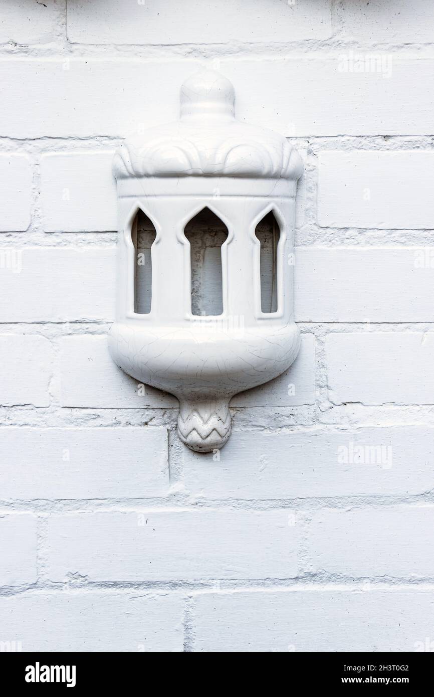 ceramic arabic decoration on white painted brick wall Stock Photo Alamy