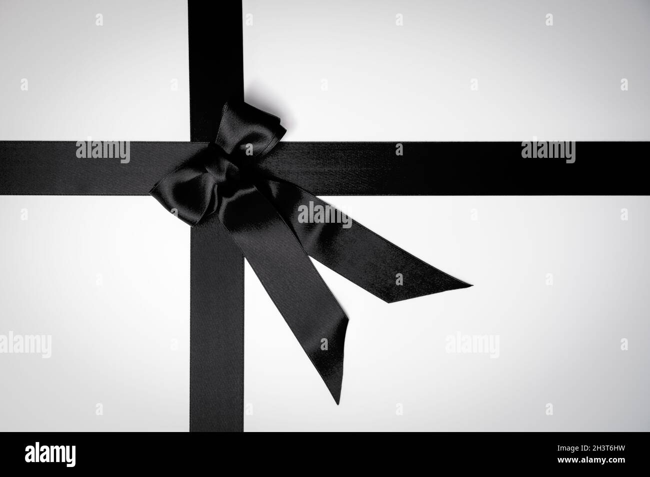 Black Friday or mourning concept with black tied ribbon bow Stock Photo
