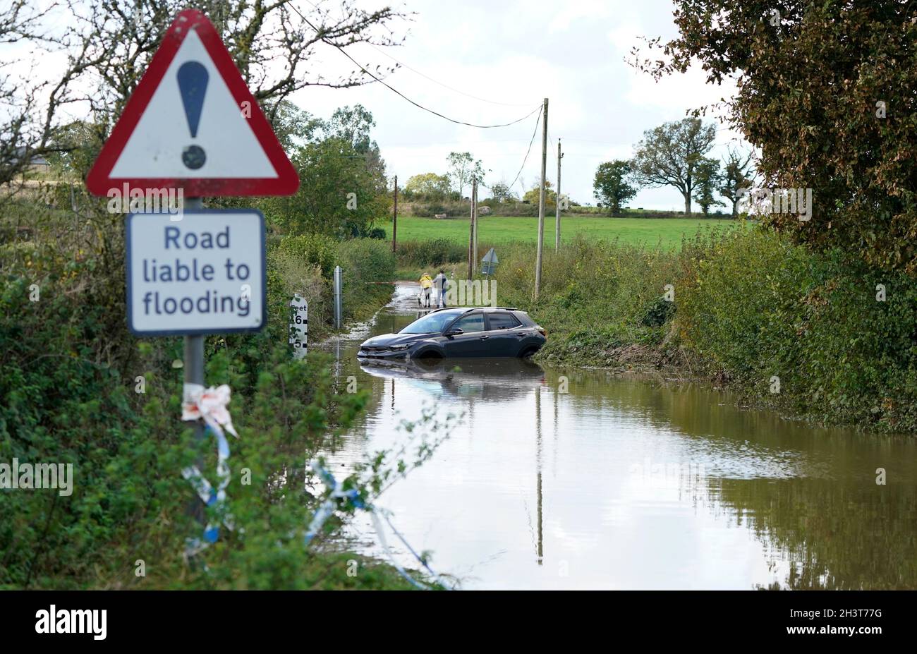 An abandoned car in flood water near to Donyatt in Somerset. Picture date: Saturday October 30, 2021. Stock Photo