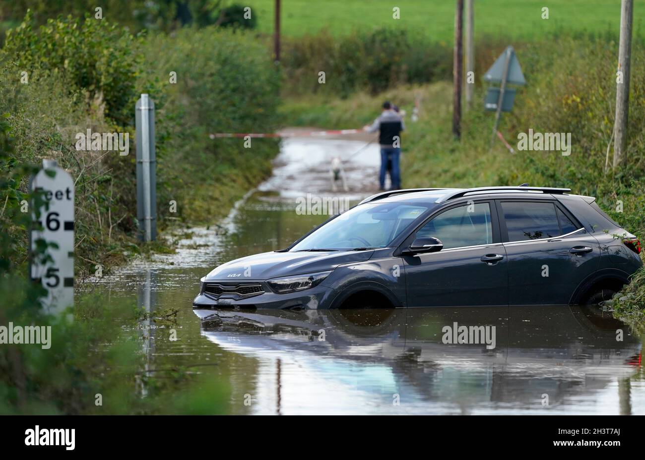 An abandoned car in flood water near to Donyatt in Somerset. Picture date: Saturday October 30, 2021. Stock Photo