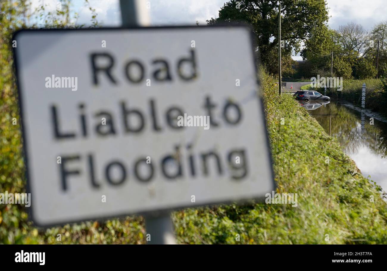 An abandoned car in flood water near to Donyatt in Somerset. Picture date: Saturday October 30, 2021. Stock Photo
