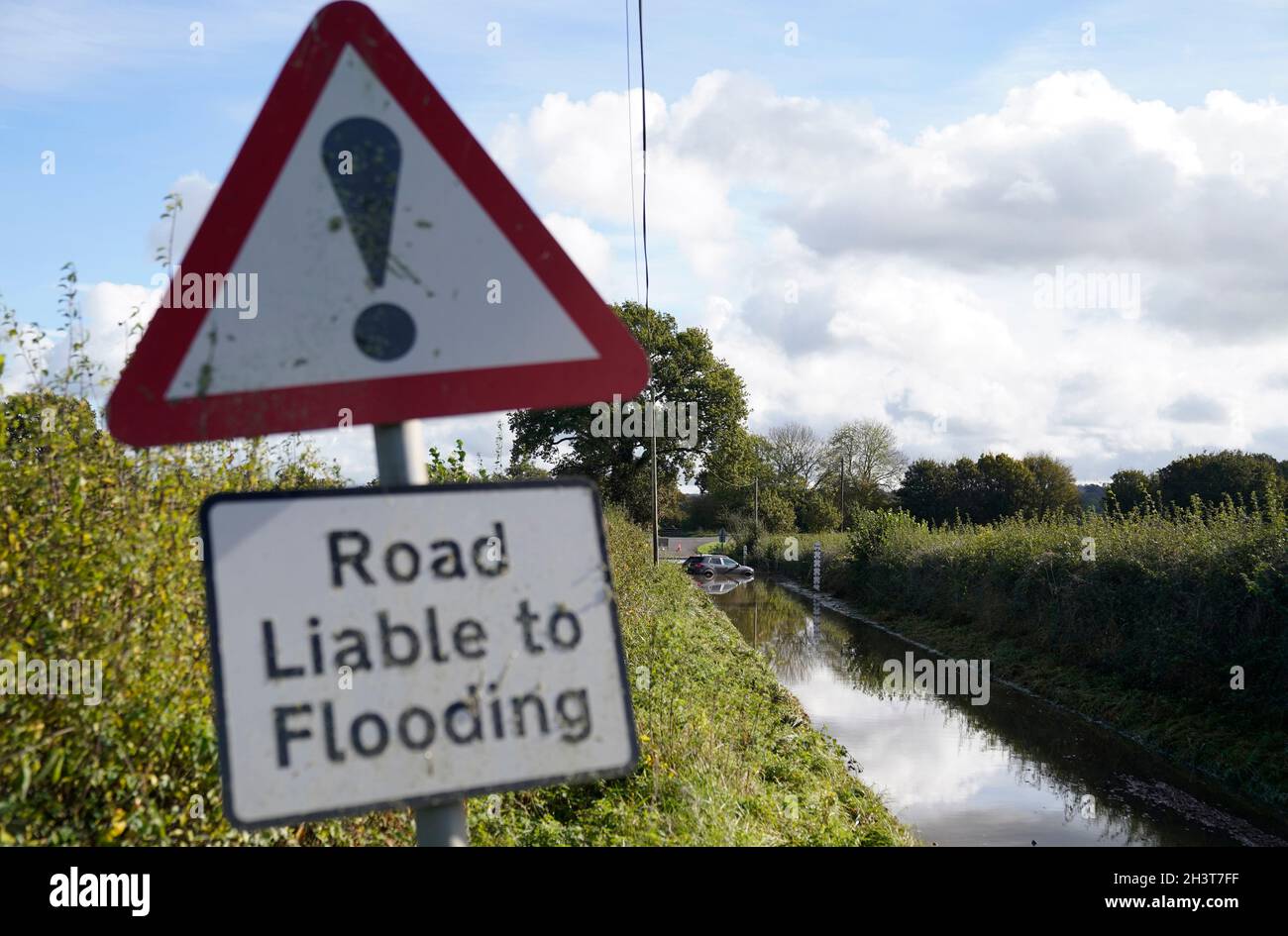 An abandoned car in flood water near to Donyatt in Somerset. Picture date: Saturday October 30, 2021. Stock Photo