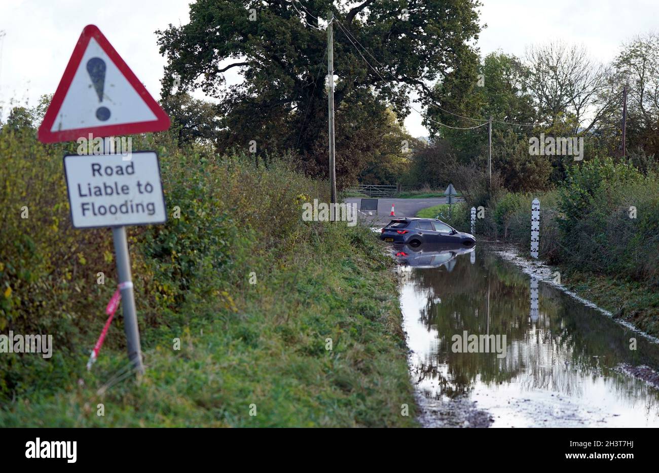 An abandoned car in flood water near to Donyatt in Somerset. Picture date: Saturday October 30, 2021. Stock Photo