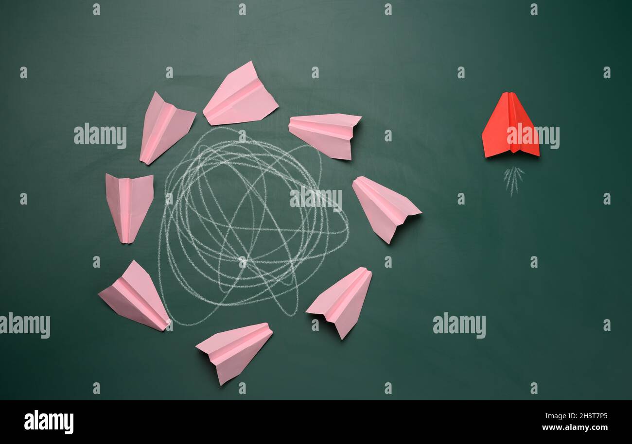 Group of pink planes fly in a circle with an intricate trajectory and