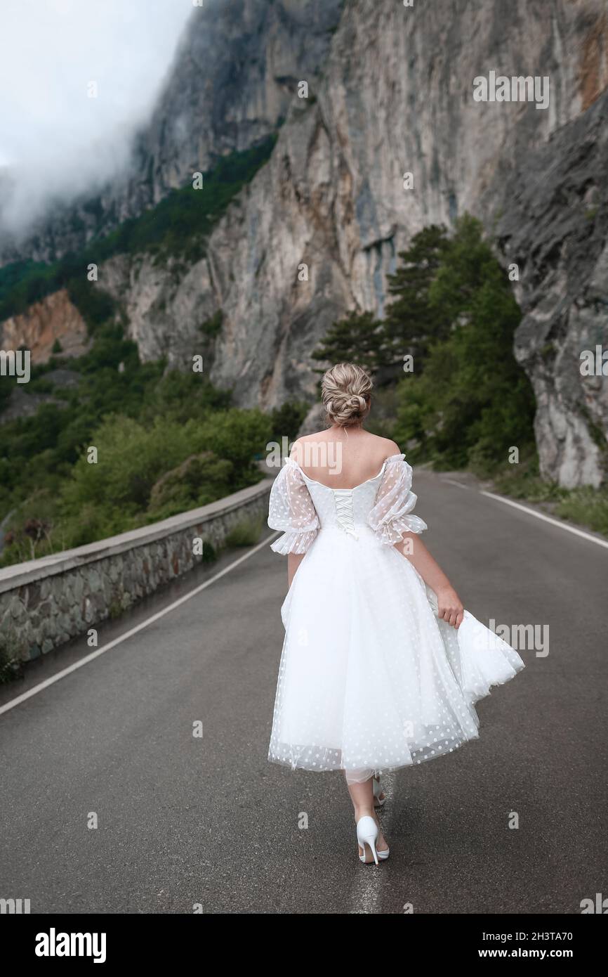 Girl in white dress walks hi-res stock photography and images - Alamy