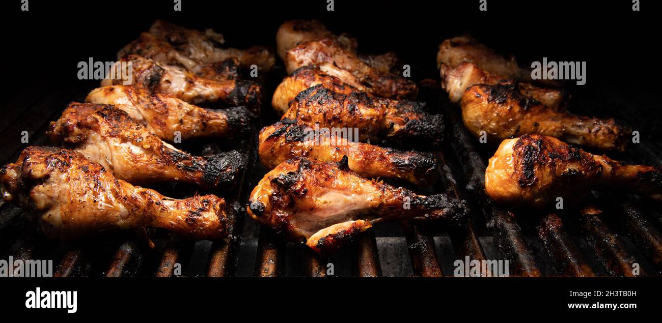 Chicken drumsticks on barbecue Stock Photo Alamy