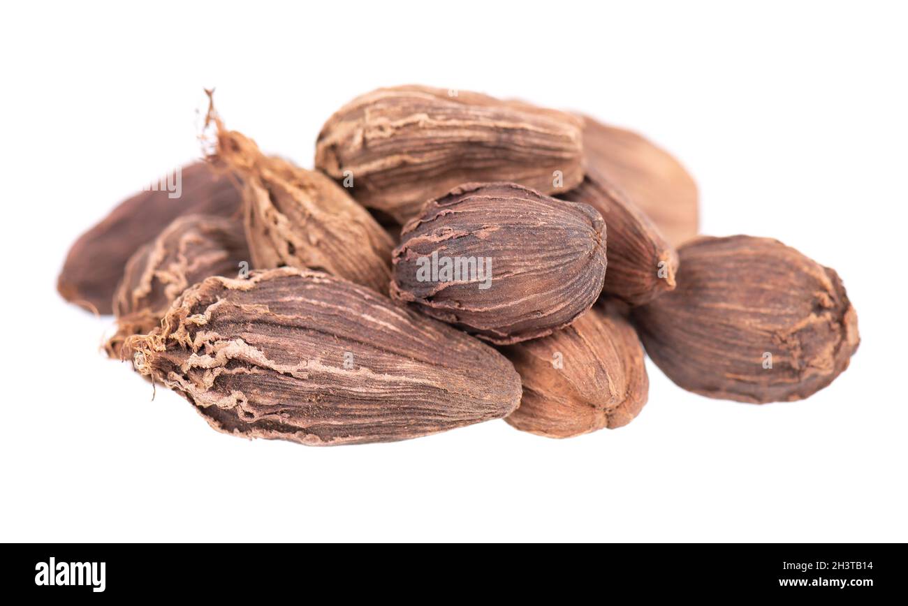 Heap of black cardamom pods isolated on white background. Black