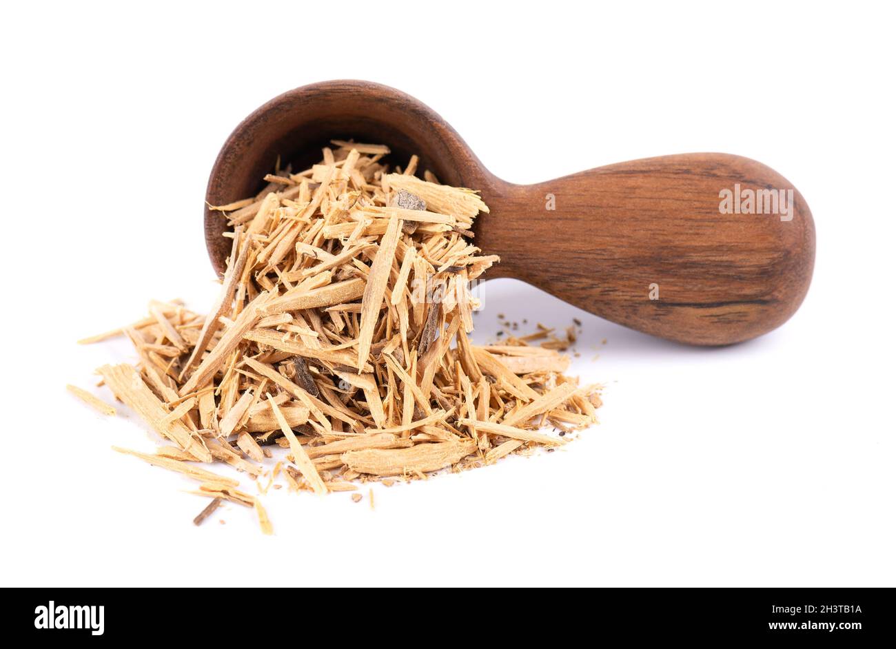 Muira Puama herbal tea in wooden spoon, isolated on white background. Natural potency wood