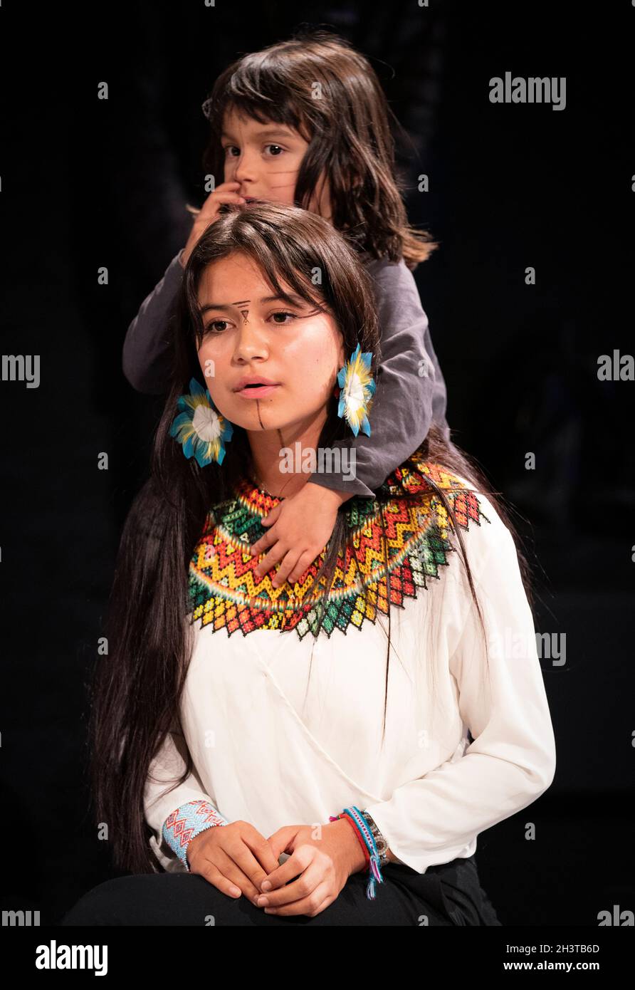 Helena Gulinga, one of the Amazonian delegates, with her son, at a ceremonial gathering to welcome the Minga Indigena coalition at the Tramway in Glasgow in a symbolic gesture to mark a unified demand for climate justice. Picture date: Saturday October 30, 2021. Stock Photo