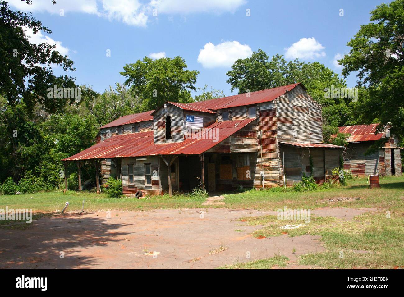 Rustic Rural Barn With American Flag Rural Texas Stock Photo