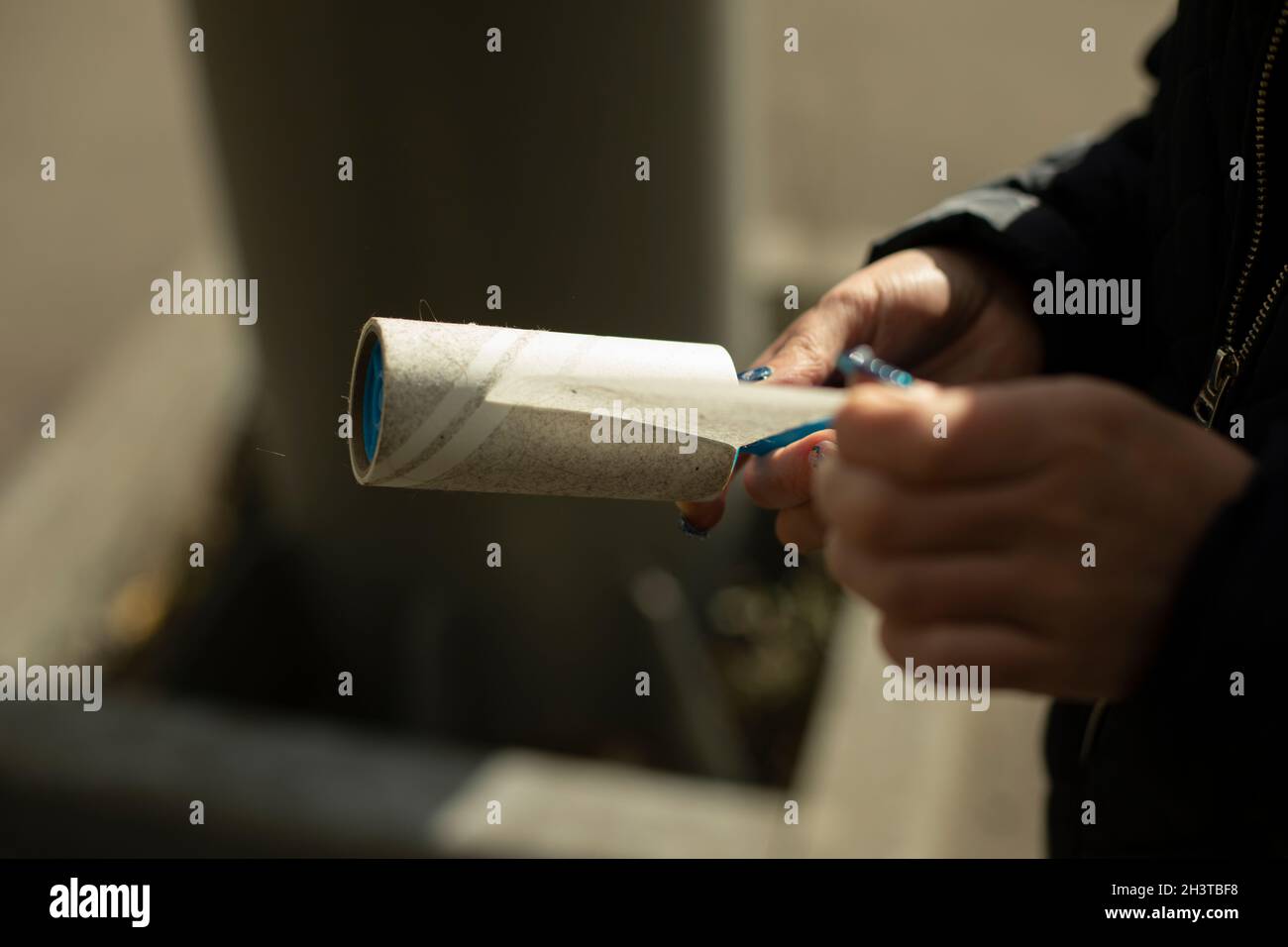 Adhesive tape to remove wool from clothes. Tool for cleaning clothes