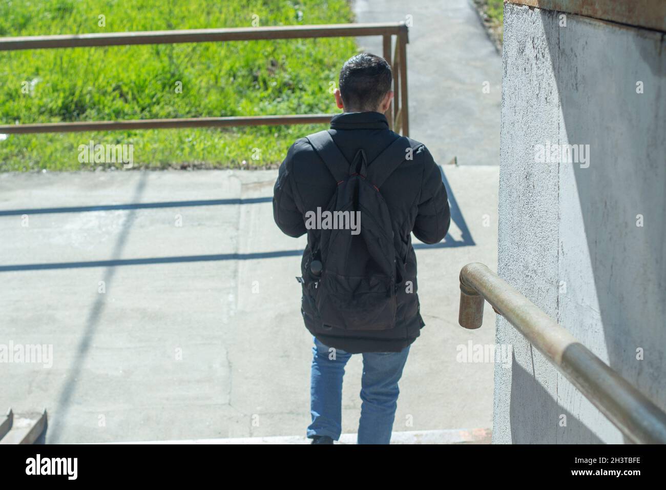 Man walking down steps rear view hi-res stock photography and images ...