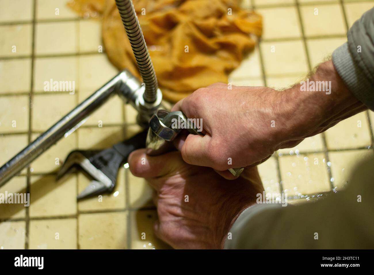 Repair of plumbing. Plumber repairs the faucet in Russia. Replacement of waterconducting crane