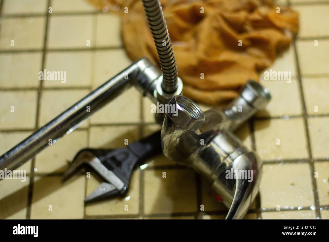 Repair of plumbing. Plumber repairs the faucet in Russia. Replacement