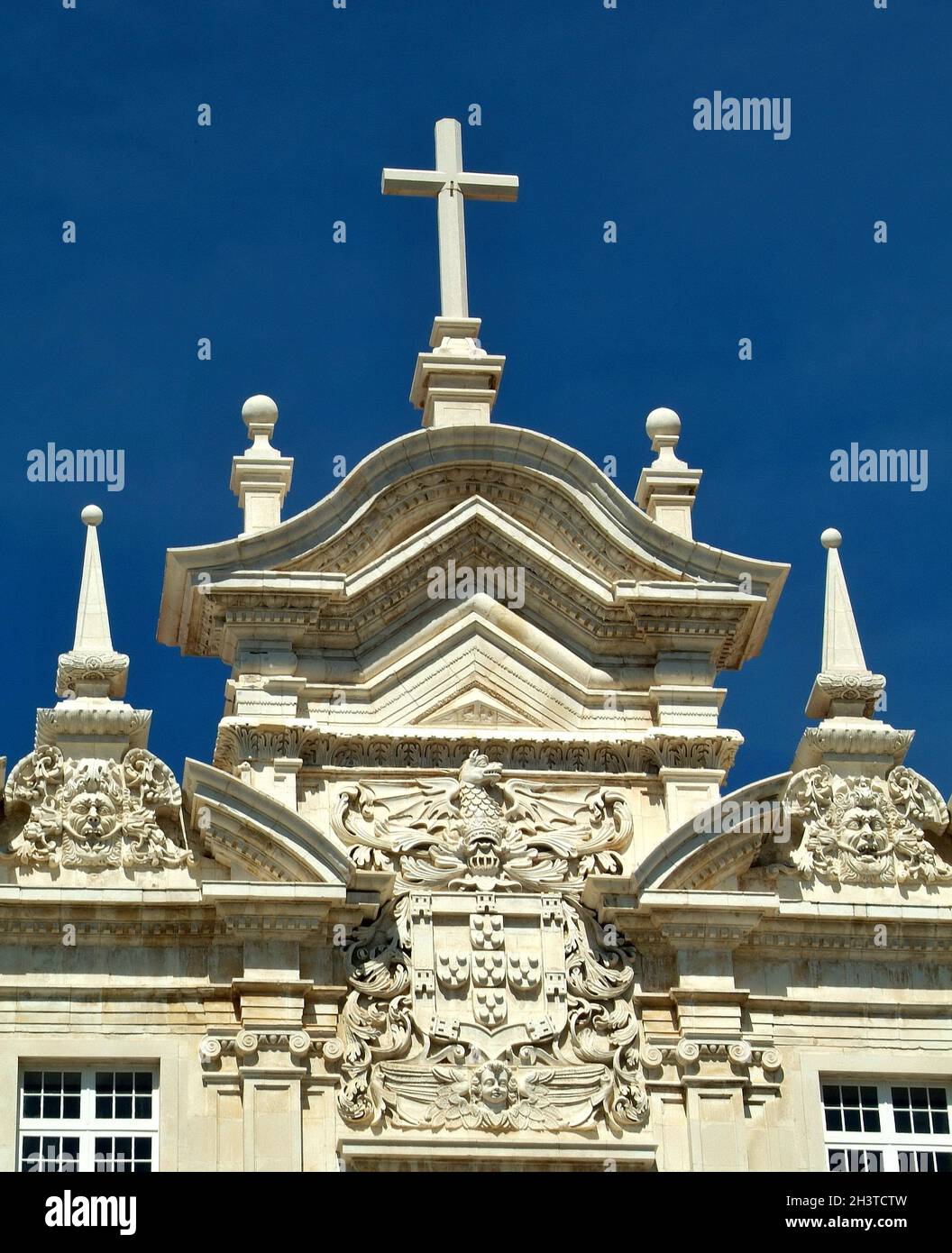 Typical church roof with a cross in Portugal Stock Photo