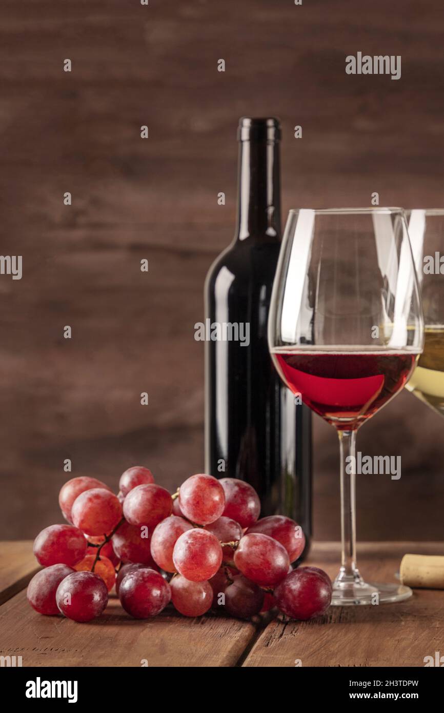 Glass of red wine with grapes and copy space Stock Photo