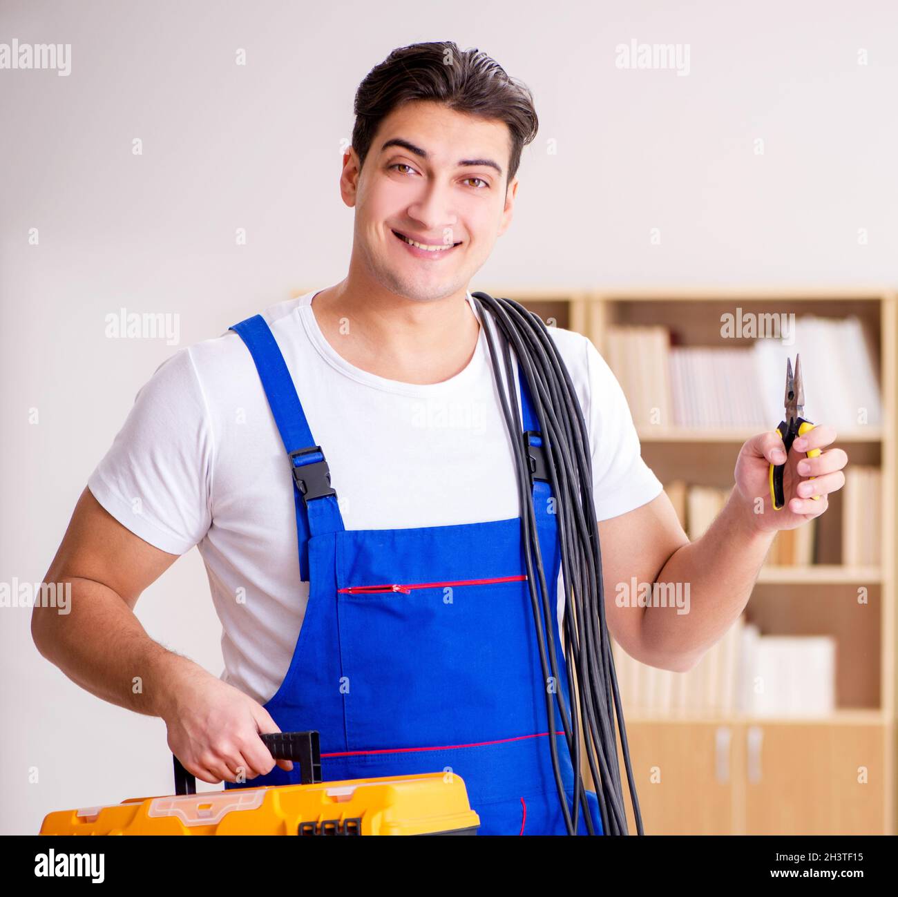 Man doing electrical repairs at home Stock Photo