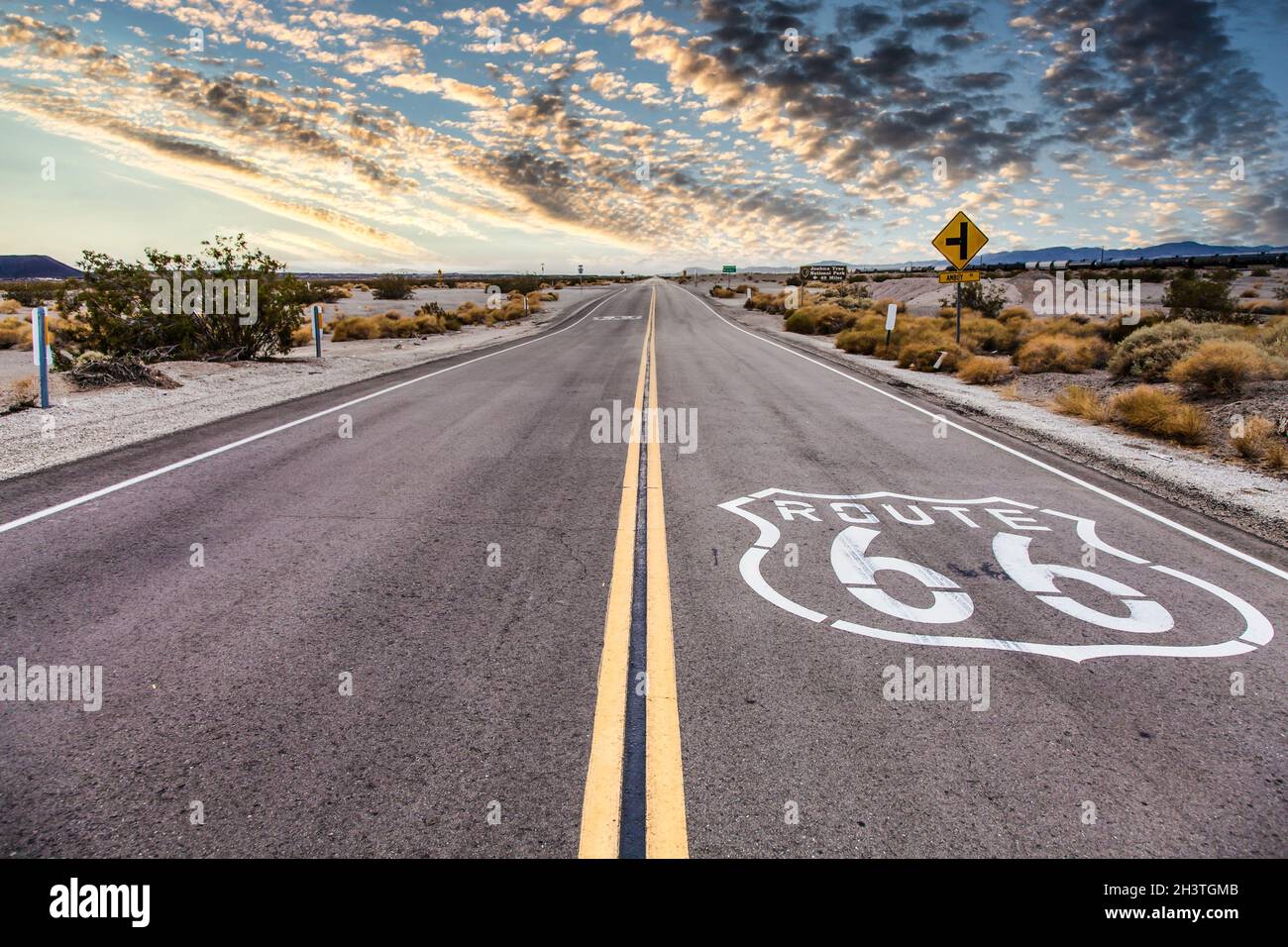 Route 66 in the desert with scenic sky. Classic vintage image with nobody in the frame. Stock Photo
