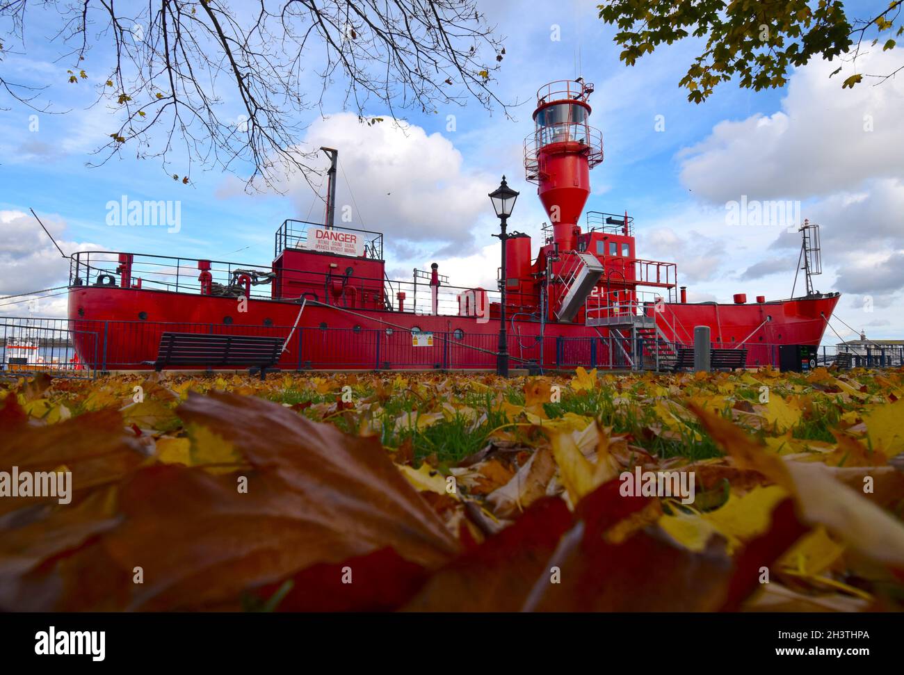 30/10/2021 Gravesend UK Former Trinity House Light Vessel LV 21 floating in a sea of autumn leaves a sure sign winter is on the way. Stock Photo