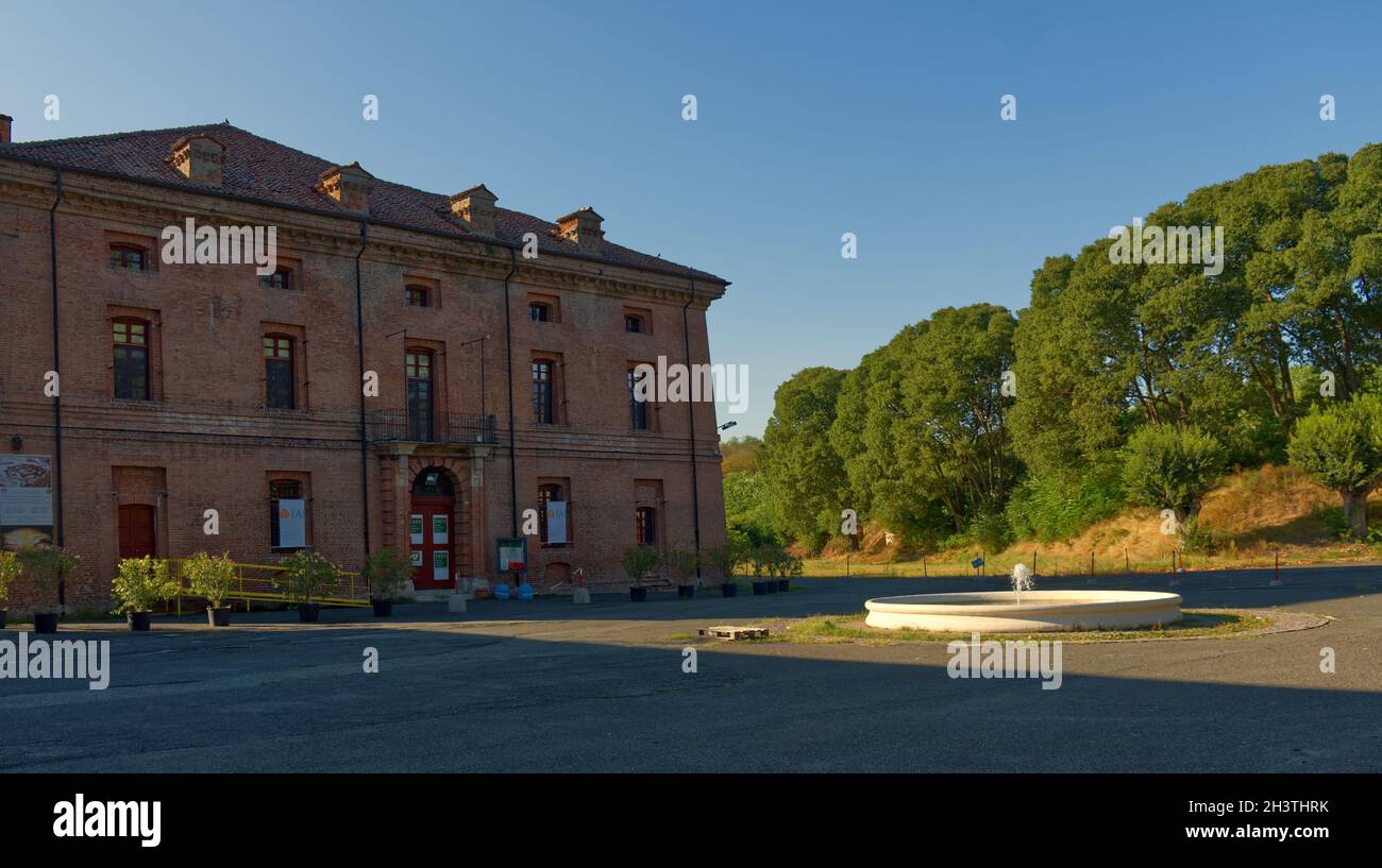 facade of a red brick palace of the fortified citadel of Alessandria, Italy Stock Photo