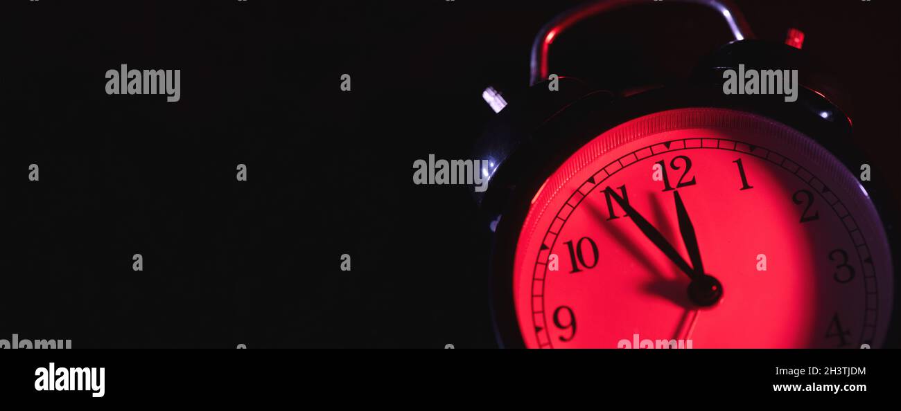 Five minutes to midnight. Changing the clocks, time adjustment