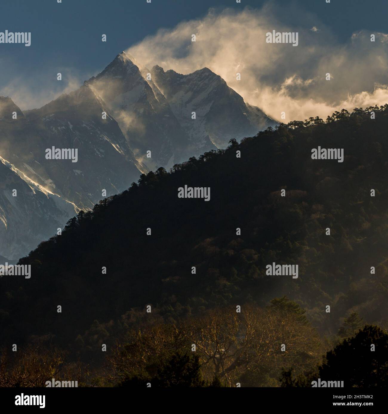 Nuptse - Lhotse Ridge and Everest above. A morning view from Deboche. Stock Photo