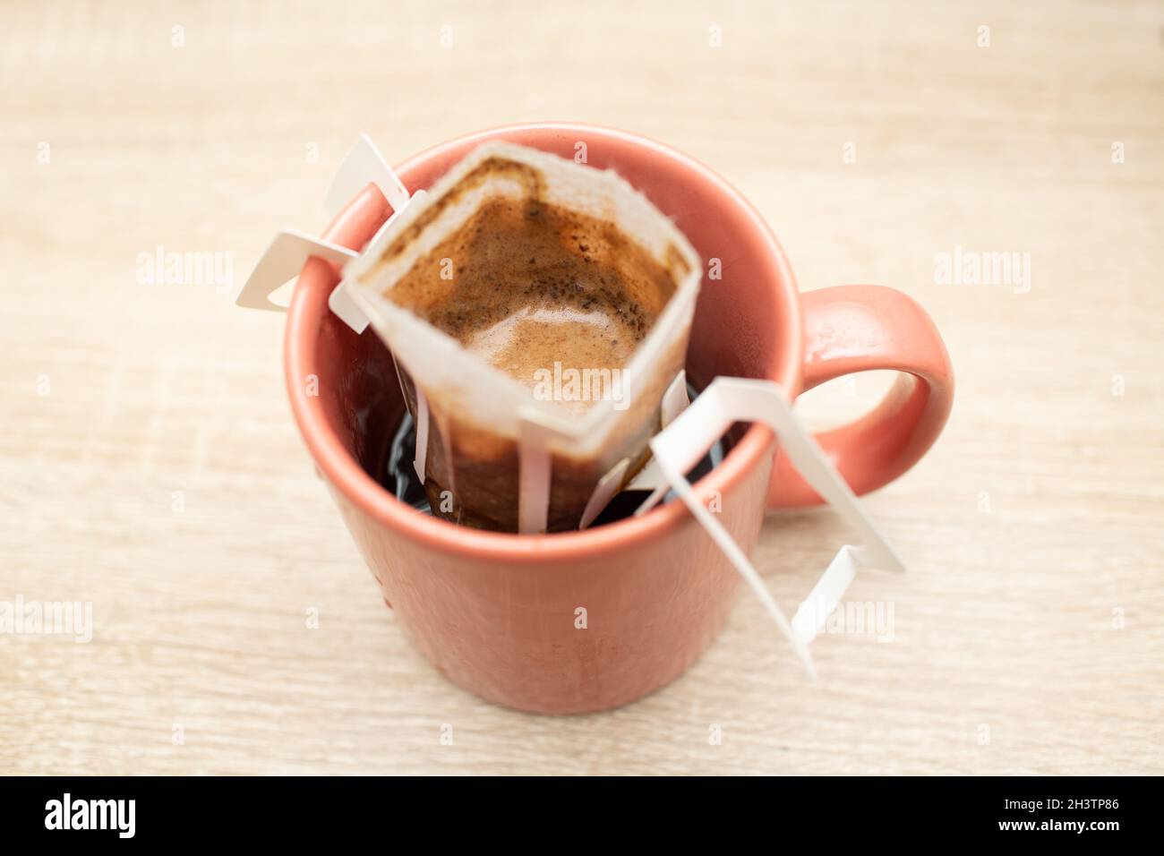 Coffee Drips in cup. Alternative brewing coffee in paper filter bags