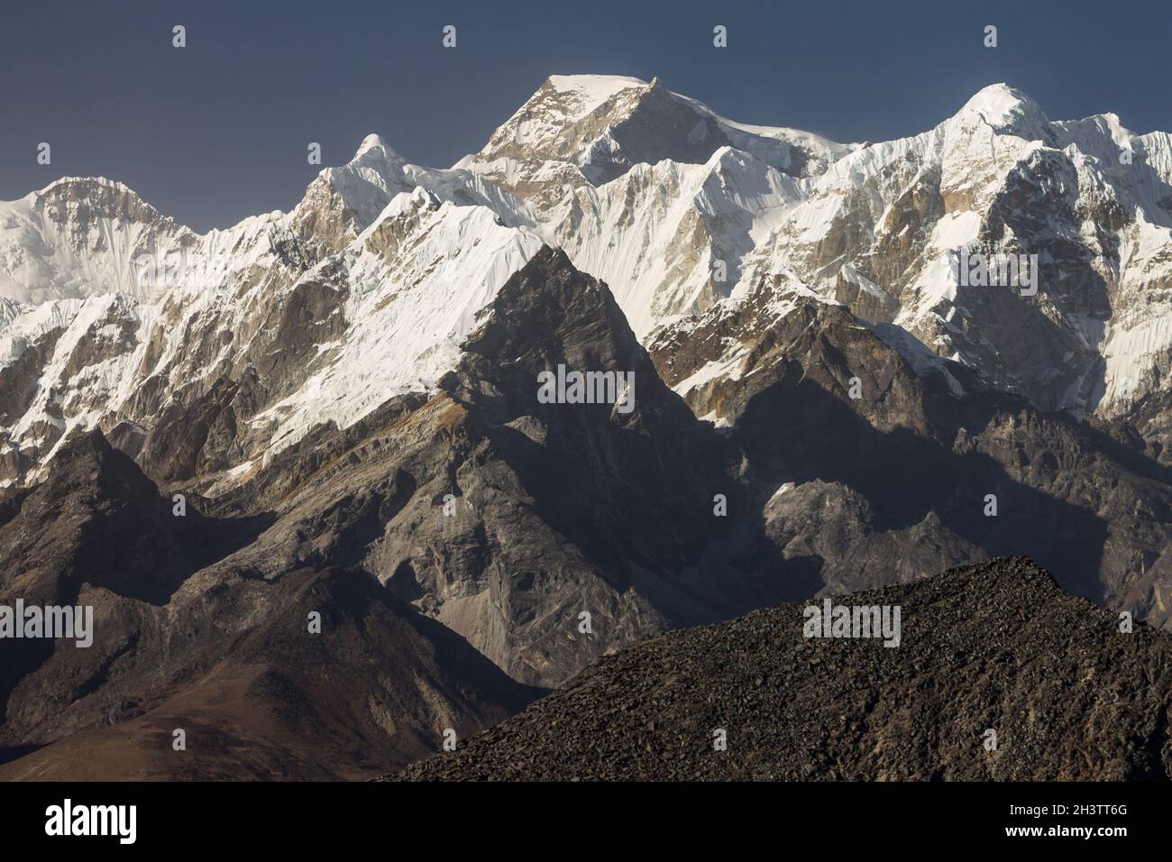 Gyachung Kang and other peaks seen from a place above the Ama Dablam Base Camp Stock Photo