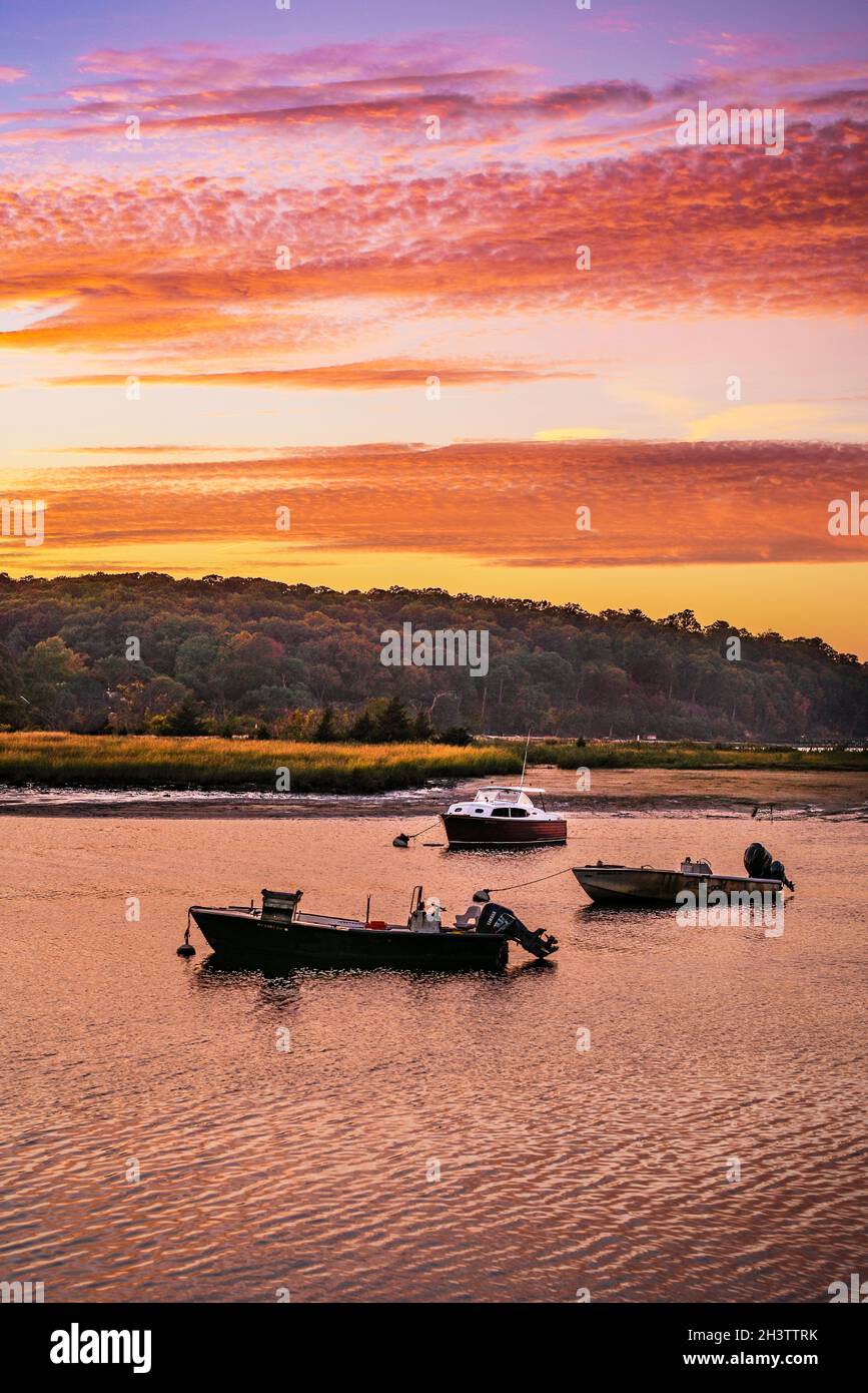 Cold Spring Harbor, New York  at sunset. With trees turning color in the autumn Stock Photo