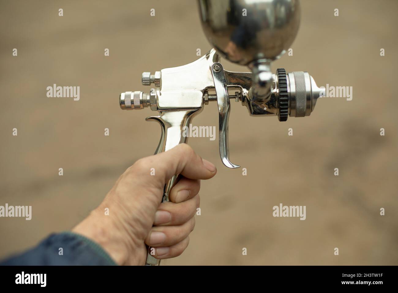 Paint sprayer. Tools for air and liquid paint. Chromeplated steel