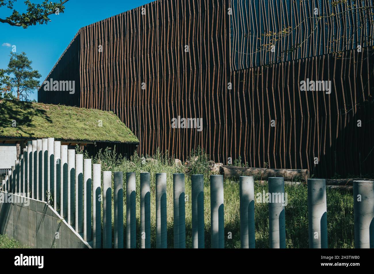 Scenic view of a modern wooden building on a blue sky background Stock ...