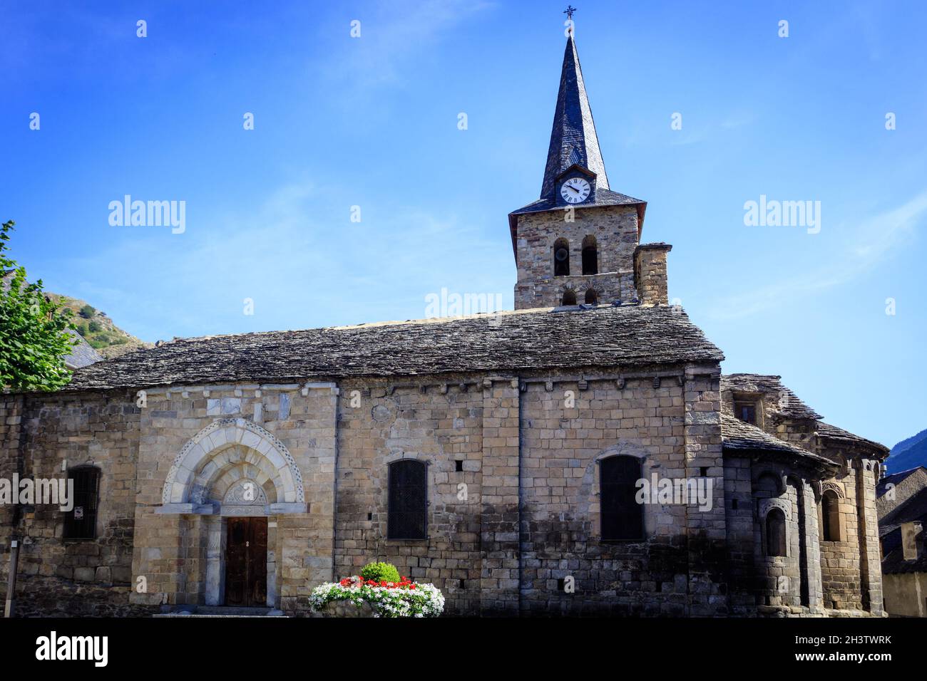 The romanesque church la Asuncion de Maria in the in the Aran Valley village of Bossot. Catalonia. Spain. Stock Photo