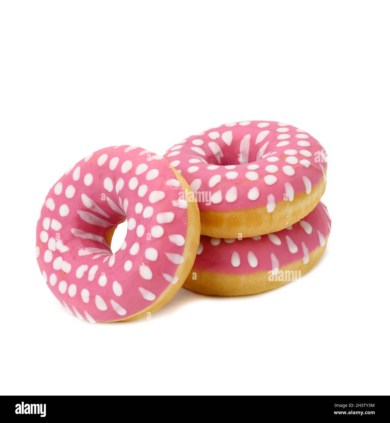 Baked round donut with pink icing and white dots isolated on white background Stock Photo
