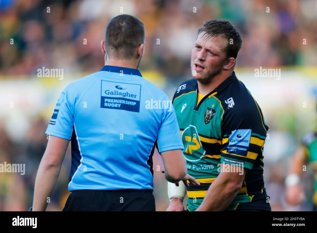 30th October 2021;  Cinch Stadium at Franklin Gardens, Northampton, England; Gallagher Premiership Rugby, Northampton Saints versus Leicester Tigers; Alex Waller of Northampton Saints talks to Referee Tom Foley after a number of infringements by his side Stock Photo