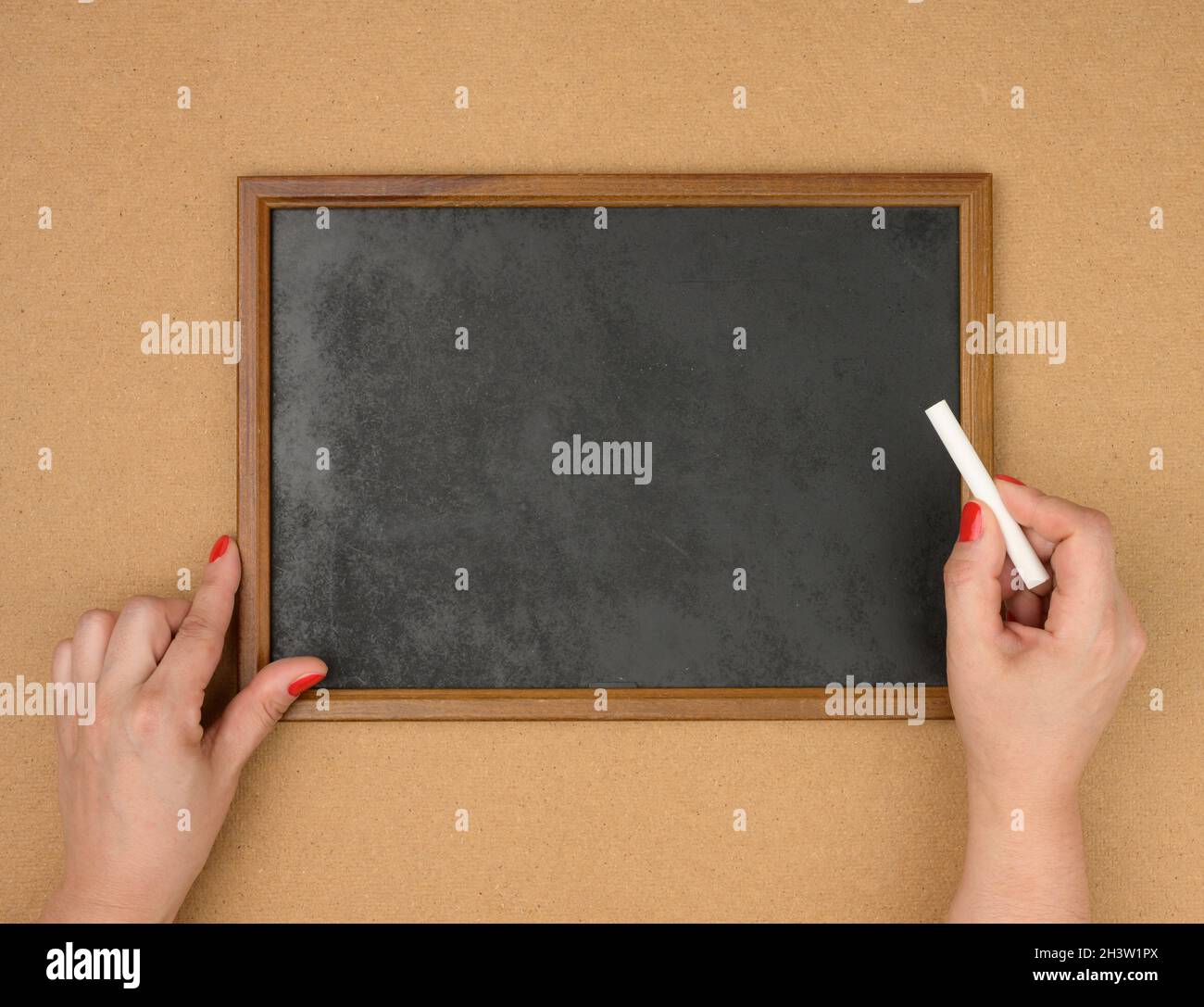 Empty rectangular brown wooden frame on a brown background, copy space Stock Photo
