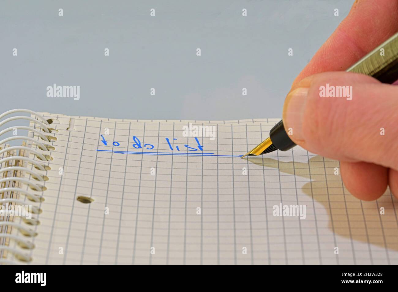 Man hand writing text - to do list - in notebook. Copy space. Concept of duties, resolutions Stock Photo
