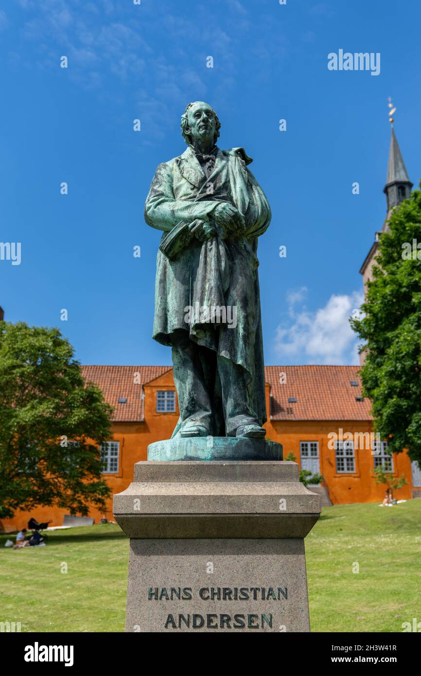 Statue of Hans Christian Andersen in the park of Saint Canute Cathedral ...