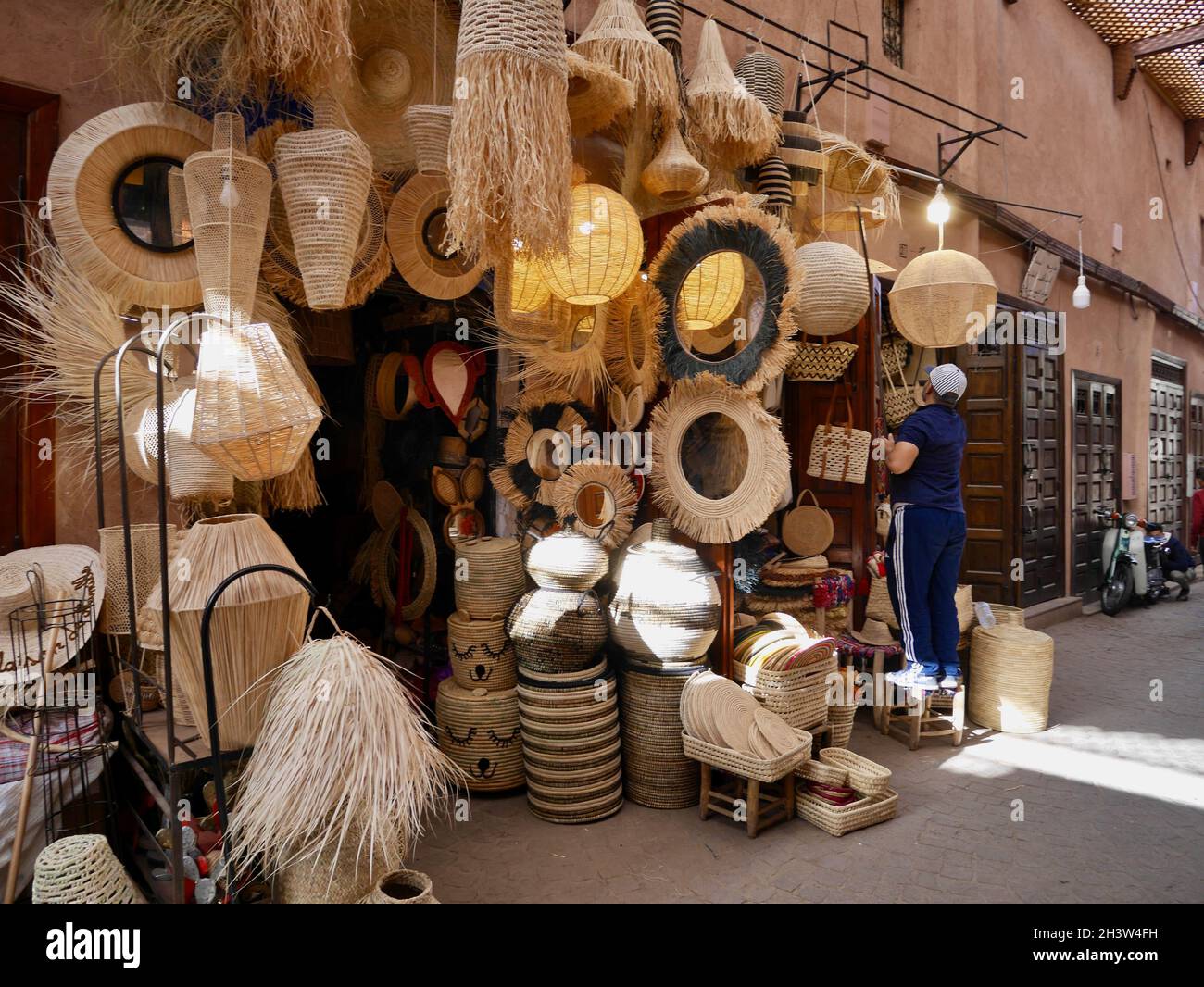 Marrakech, Morocco, 24.10.2021. Local shop selling lamps and braided goods in souk of Medina.  Stock Photo